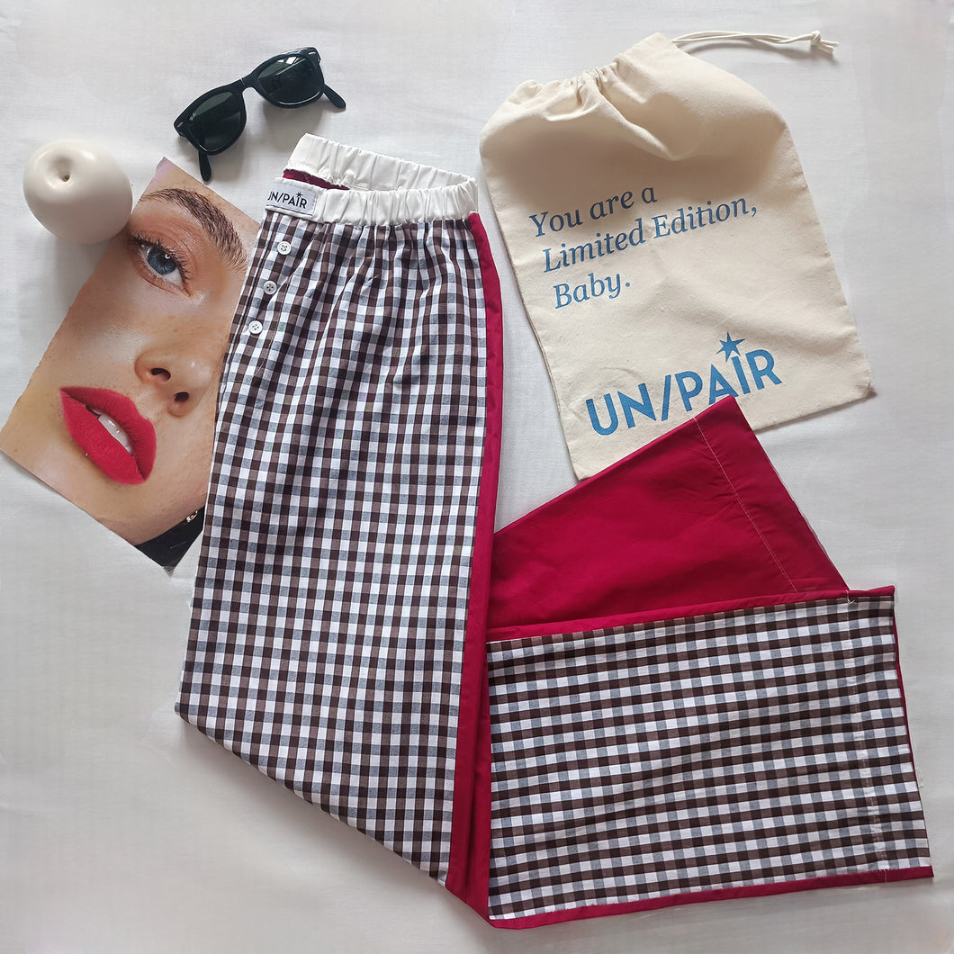 White and brown gingham trousers with palinstrawberry red back