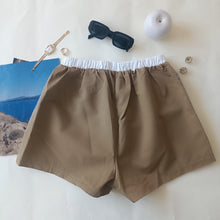 Load image into Gallery viewer, Light blue shorts with aqua green stripes and tobacco back
