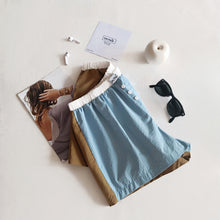 Load image into Gallery viewer, Light blue shorts with aqua green stripes and tobacco back
