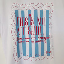 Load image into Gallery viewer, Light blue striped t-shirt in a frame
