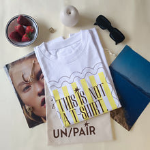 Load image into Gallery viewer, Yellow striped t-shirt in a frame
