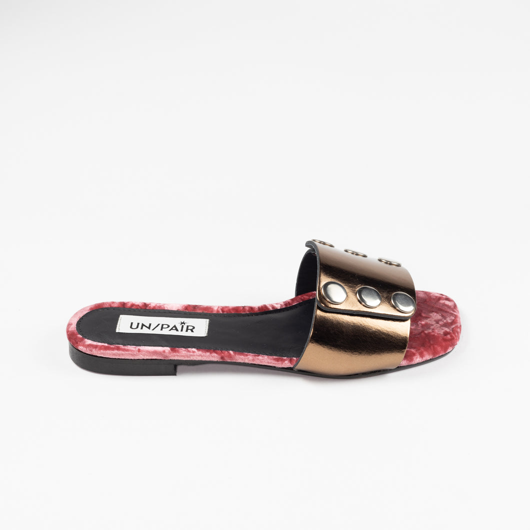 UN/PAIR's bronze sandal with third silver colored mask